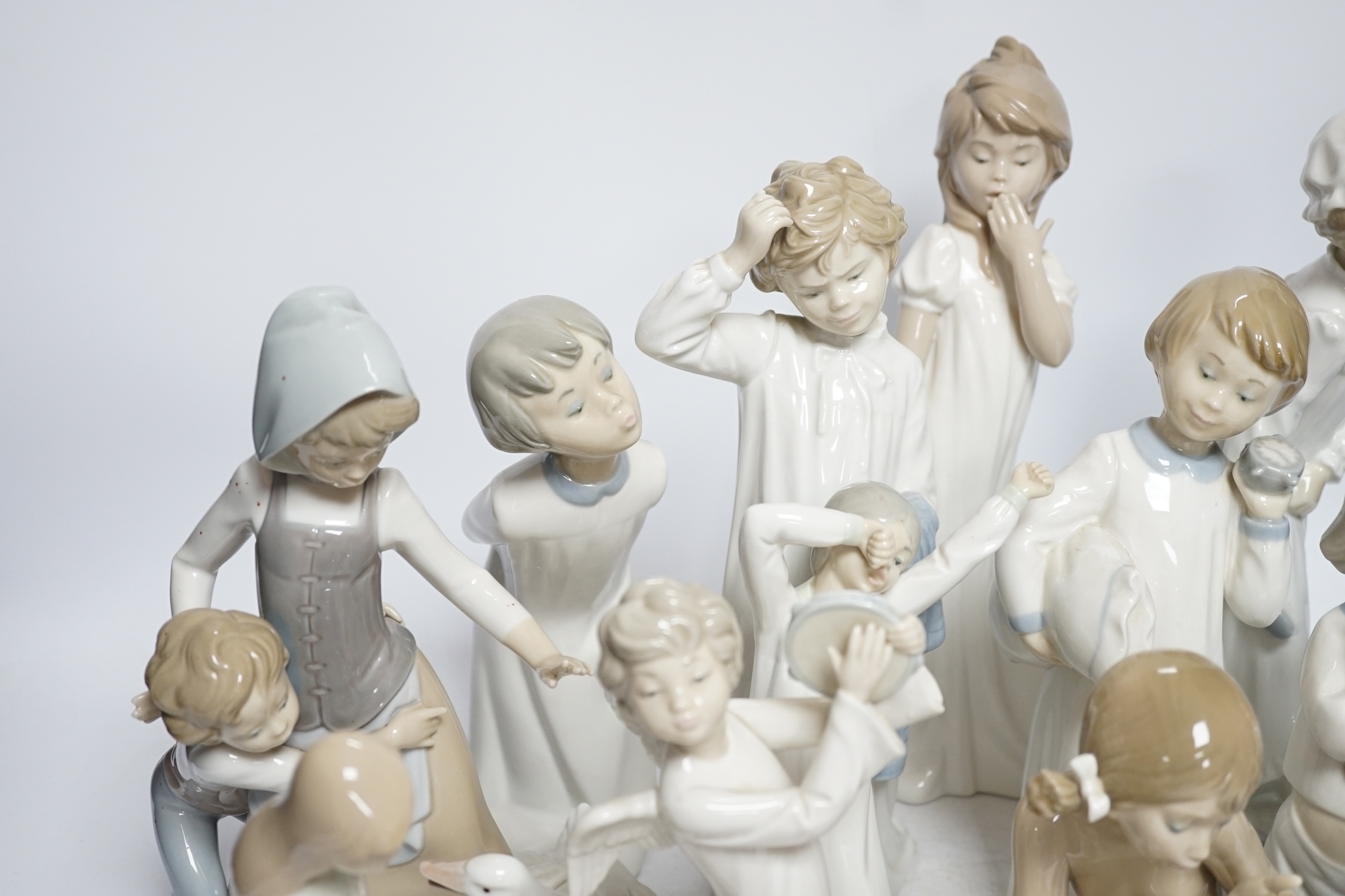 A group of various Lladro figures (16 + plaque)